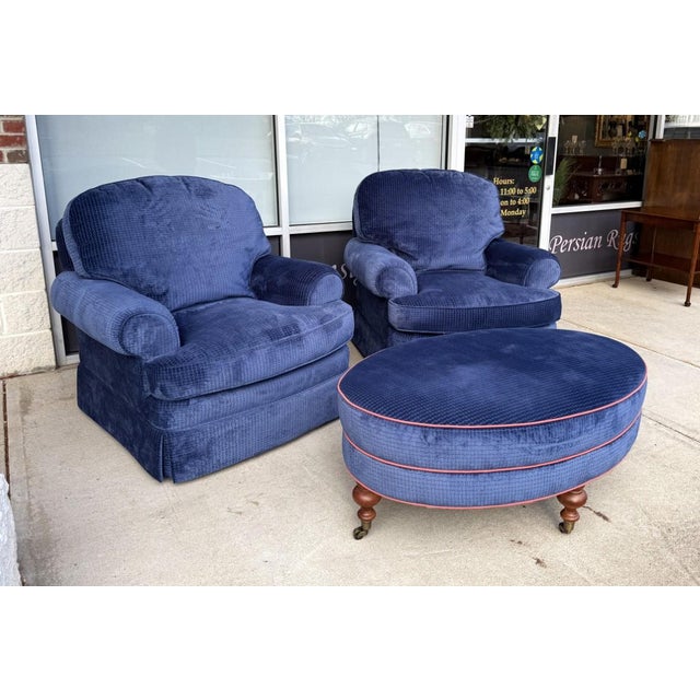This three-piece high-end custom upholstered set includes a pair of plush club chairs and a coordinating ottoman, all...