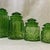 Agreat vintage set of emerald green glass kitchen canister set with a mooon and stars pattern. This s1960's era set has a...