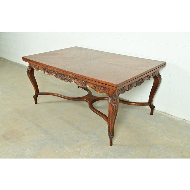 A gorgeous French Provincial Louis XV style extension dining table In the manner of Baker Furniture USA, Circa 1960s...