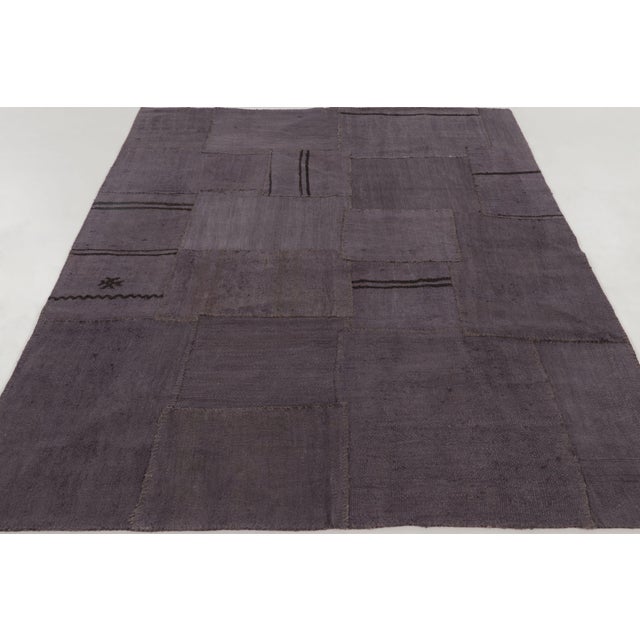 Handwoven in hemp circa 1950–1960, this 6x8 vintage Turkish patchwork rug is a sophisticated addition to Rug & Kilim’s...