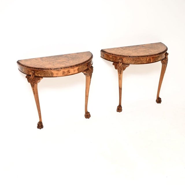 A stunning pair of antique burr walnut console tables in the Queen Anne style. They were made in England, they date from...