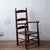 An oak ladderback open armchair from the Rock Hill area of South Carolina, dating to the mid-19th century, with slat back...