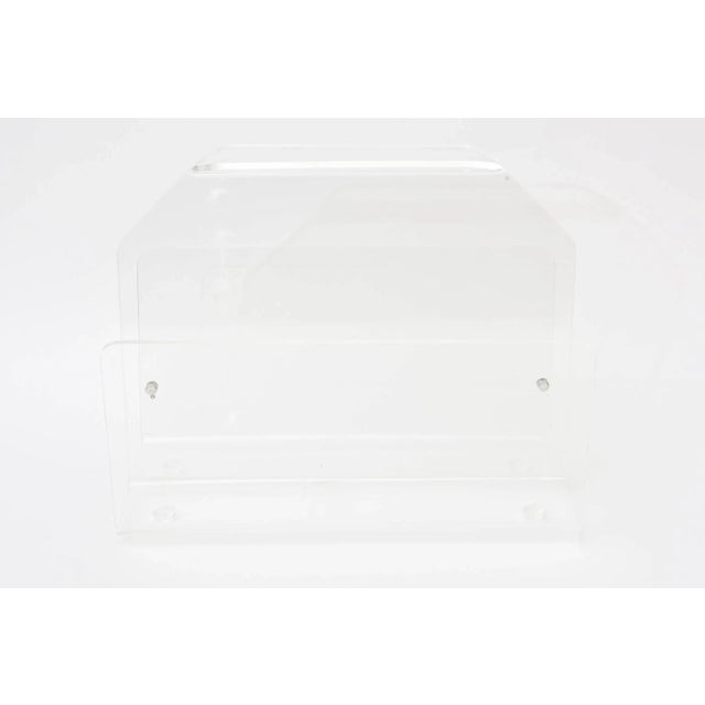 This vintage two-part compartment lovely lucite magazine holder is in very great condition. It is non obtrusive and can be...
