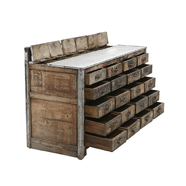 Tea counter in wood and zinc with 20 drawers. This piece is designed in the style of the selected designer and/or...