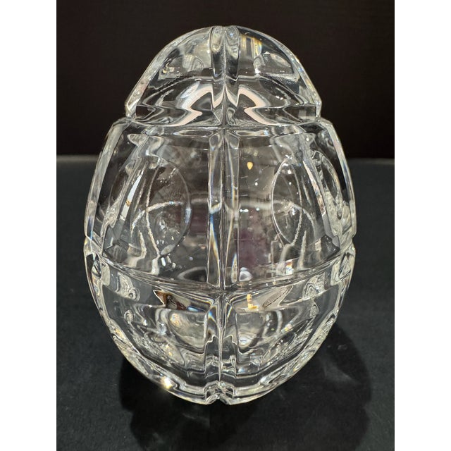 Clear crystal Faberge egg paperweight with decorative cut pattern and classic egg form. Acid etched Faberge on the bottom....