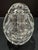 Clear crystal Faberge egg paperweight with decorative cut pattern and classic egg form. Acid etched Faberge on the bottom....