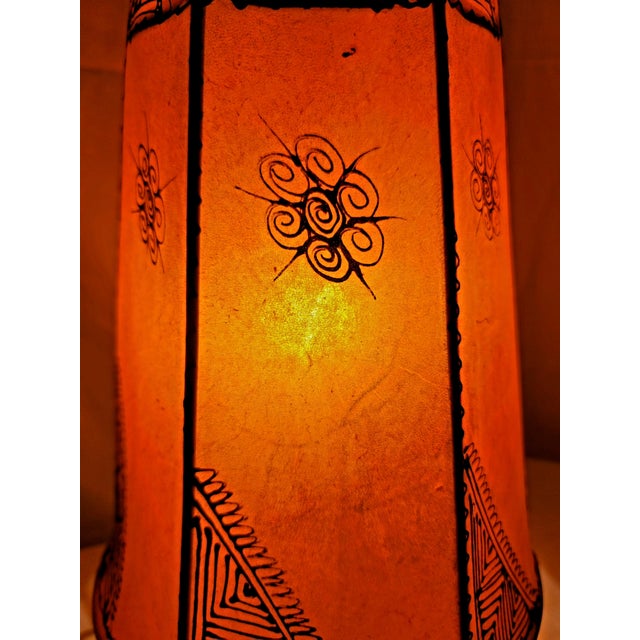 A radiant piece of Moroccan artistry, this handmade henna lamp brings the warmth of the Maghreb into any space. Crafted by...