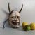 This expressive wooden Hannya mask was hand-carved and then hand-painted. Dimensions: height 28 cm, width 17 cm, depth 11...