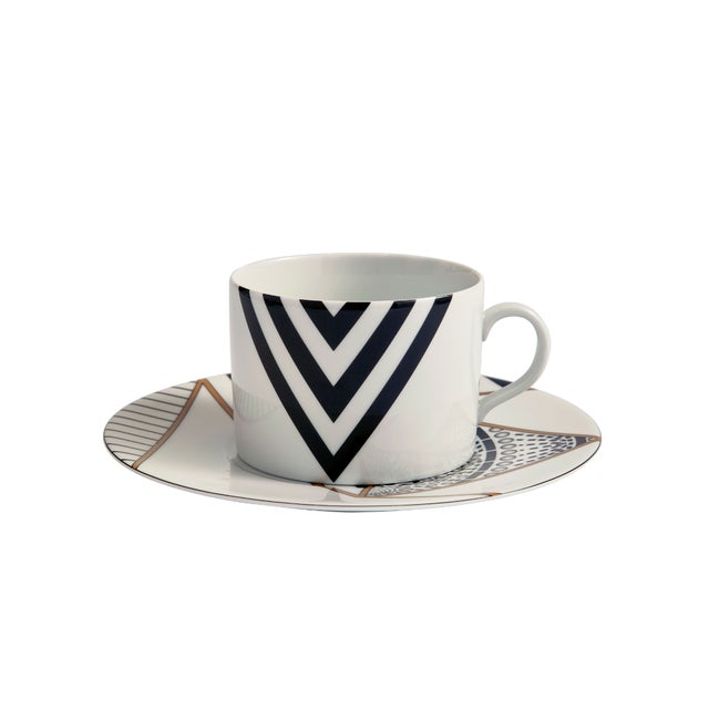 Crafted from fine porcelain, this set of four Alina Teacups with coordinating saucers brings a bold graphic sensibility to...