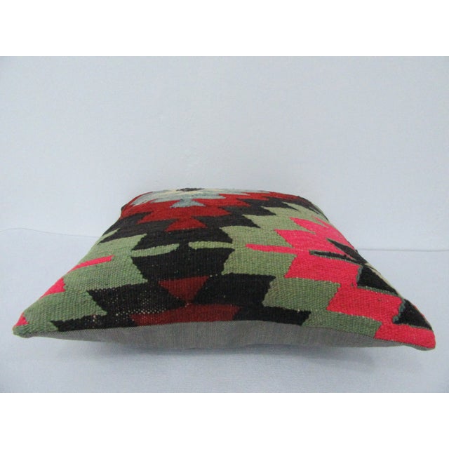 This is a pillow cover made from a vintage kilim rug. The piece was properly washed and ready to use. Pillow inserts not...