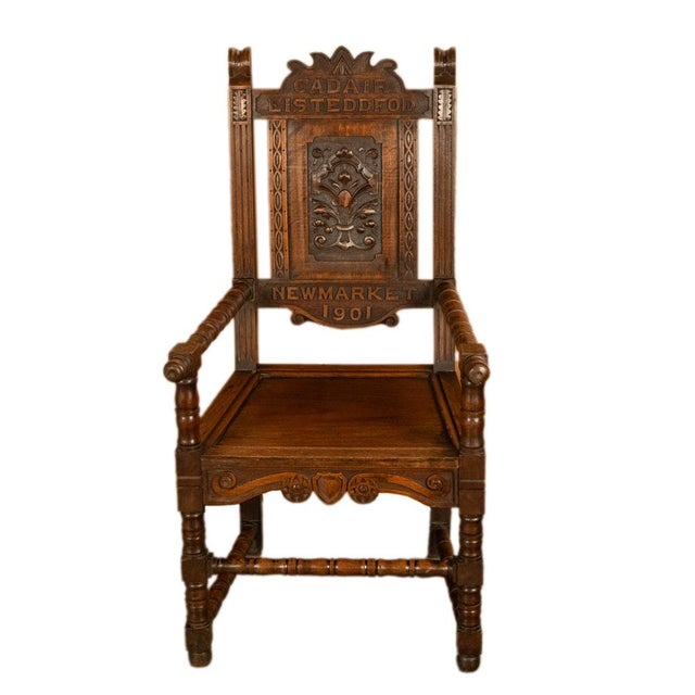 An important antique Welsh vernacular Eisteddfod carved oak throne chair (Cadair Eisteddfod), from North Wales,...