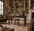This country store table is constructed of solid oak, with turned baluster legs, canted chamfered corner blocks, and a...