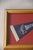This vintage Boston Red Sox pennant is framed against a new deep red background and finished with a vintage gold-tone...