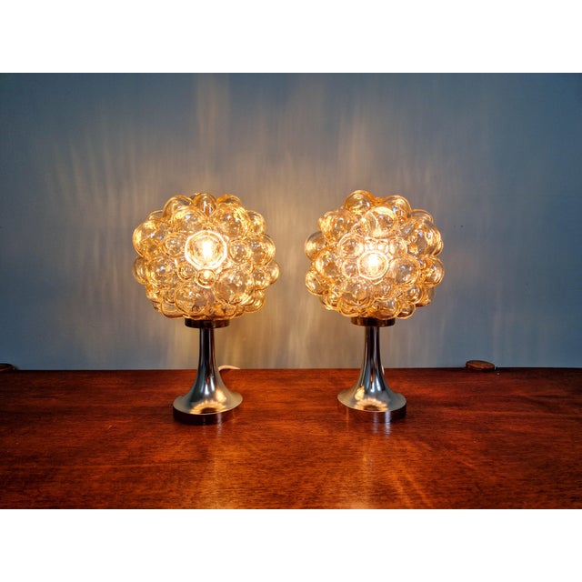 Pair of amber-colored bubbled glass table lamps, design Helena Tynell, for the German manufacturer Glashütte Limburg,...