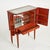 Mid century bar cabinet in excellent condition. Inside original mirrored glass, glass racks on the inside of the doors,...