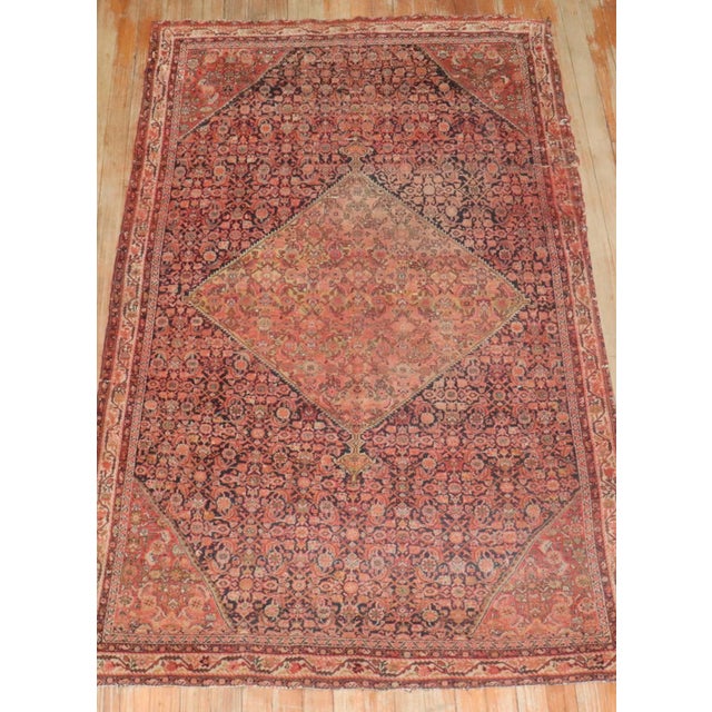 A naturally distressed Persian Farahan rug from the late 19th century circa 1875, measures: 3'7" x 6'
