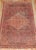 A naturally distressed Persian Farahan rug from the late 19th century circa 1875, measures: 3'7" x 6'