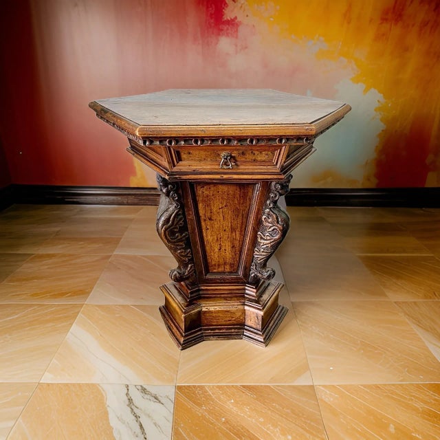 An antique Italian Tuscan center table that dates back to the 18th Century. The table is made from high-quality walnut...