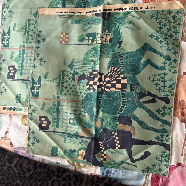 Two identical squares of fabric that appears to be cotton. Beautiful medieval print and finished edges on the top and...