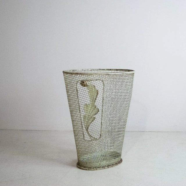 Grid-worked metal umbrella stand embellished with a metal leaf with Pontiano decoration, late 1950s production. This piece...