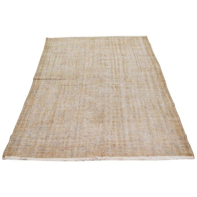 Vintage Hand-knotted with care using traditional rug-making techniques, this wool rug blends timeless craftsmanship with a...