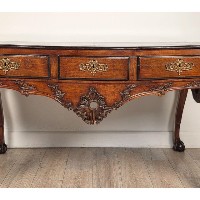 Baroque Portuguese Desk - Center Table circa 1880 made of walnut with ebonized. Richly carved after pieces first made in...