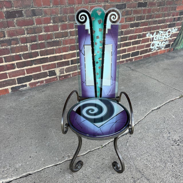 Unique postmodern chair by Joan Irving, featuring colorful geometric art glass panels with bold spiral designs and a...