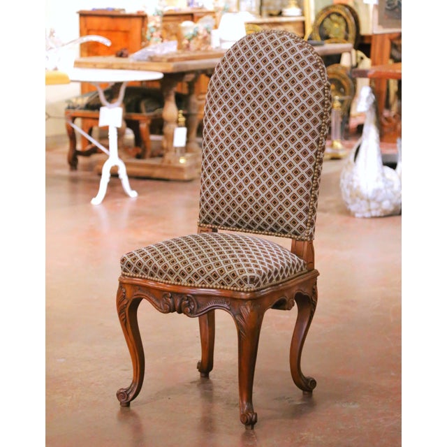 Add French elegance and comfort to a study, vanity, or writing desk with this antique-style Louis XV chair. Crafted in...