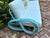 Pretzel rattan sofa refurbished in a modern twist with blue color and new white outdoor cushions. Mid century charm with...
