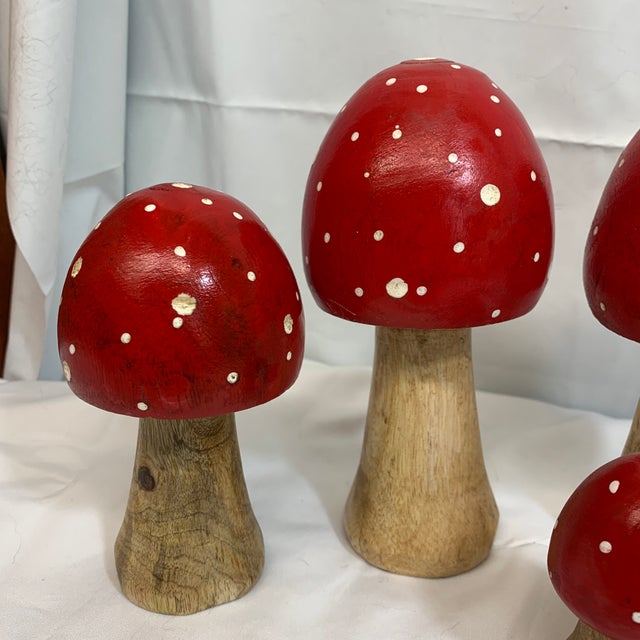 Offered here is a set of different sized folk art mushrooms. Hand carved and hand painted.