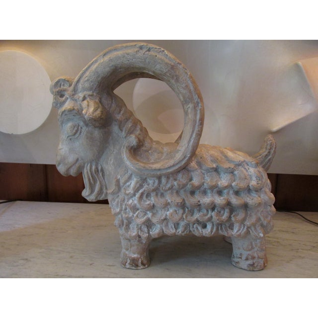 Mid Century terracotta horned ram by Austin Productions dated 1961. Visually impactful and somewhat iconic, having...