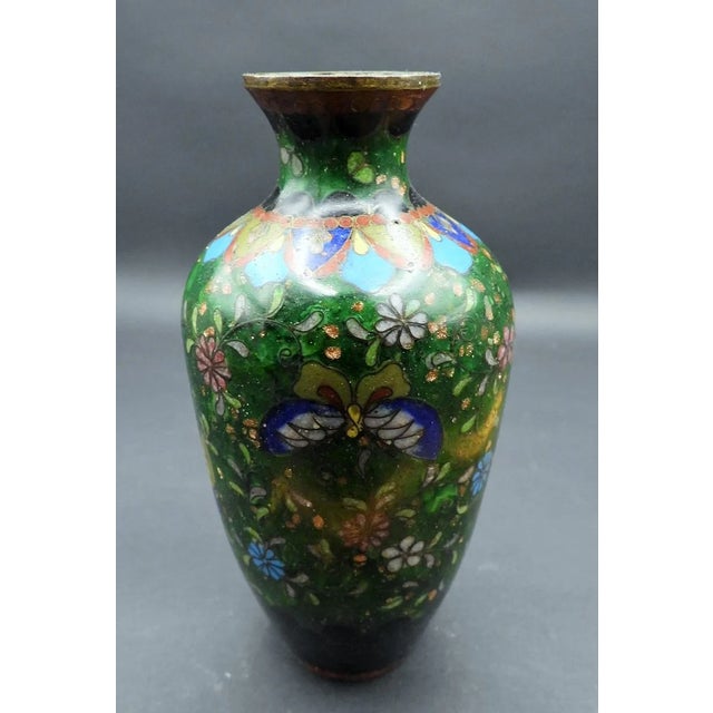 This marvelous antique Meiji Period cloisonne vase is created in gorgeous dark green enamel background with black base and...