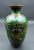 This marvelous antique Meiji Period cloisonne vase is created in gorgeous dark green enamel background with black base and...