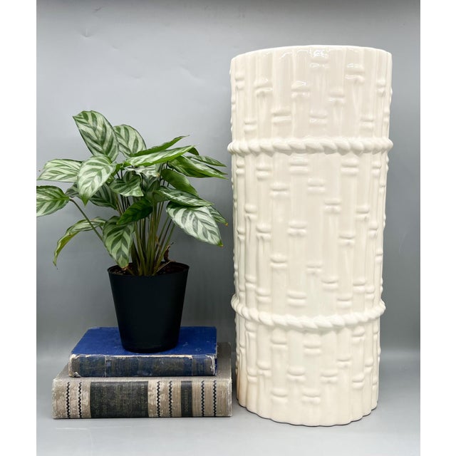 Stunning tall vintage ceramic umbrella stand features a faux bamboo motif in a soft ivory-white glaze with rope-form bands...