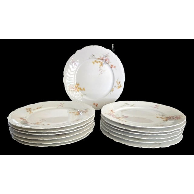 Exquisite set of 13 antique Rosenthal Monbijou dinner plates, produced between 1891 and 1906. Crafted from fine bone...
