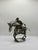 A striking vintage wire sculpture depicting a horse and rider, handmade from layered black and brass toned wire. The piece...
