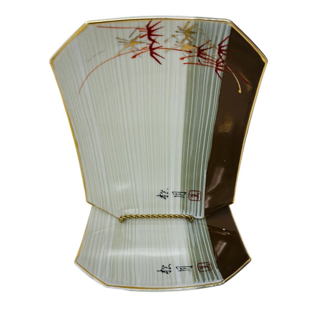 Vintage Asian Ceramic Sushi Service Plates a Pair. Each plate features a glossy striped tan color, lilies, and raised gold...