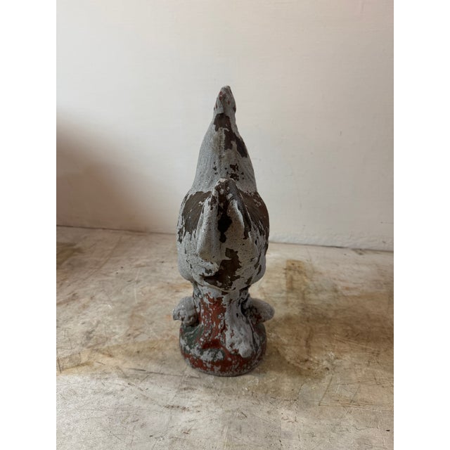 This vintage French cast concrete rooster sculpture is a beautifully aged decorative piece, ideal for both indoor and...