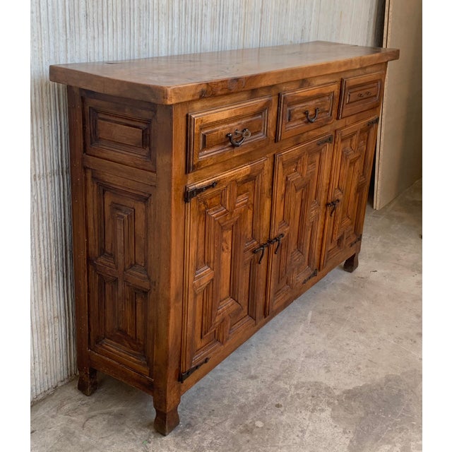 From Northern Spain, constructed of solid oak, the rectangular top with molded edge atop a conforming case housing three...