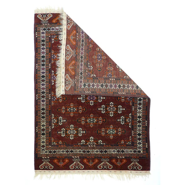 In the style of larger Yomud tribal main tent carpets, this nomadic scatter shows color diagonals of Kepse emblematic guls...
