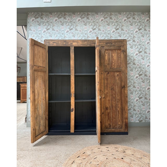 With its generous proportions and magnificent patina, this antique workshop cabinet captivates with its unique character....
