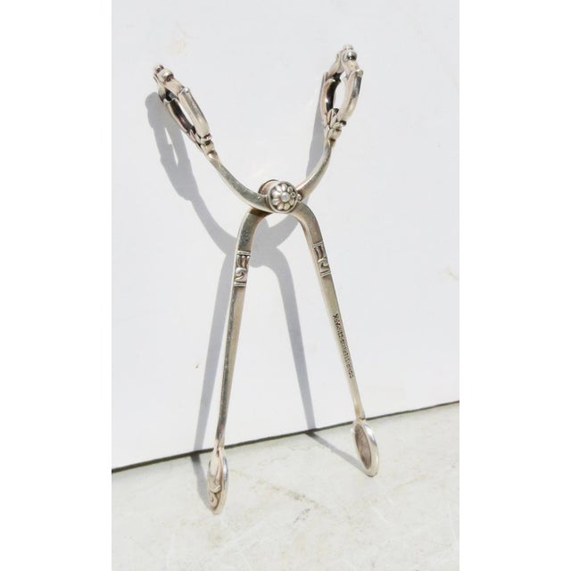 Danish Modern sterling silver sugar tongs. Beautiful design in the Art Deco/ Danish design theme. Tension spring open and...