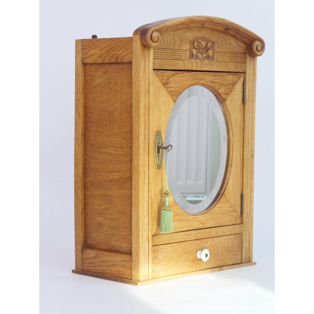 Small Art Deco Floral Carved Wooden Cabinet with Oval Beveled Mirror, 1920s For Sale - Image 6 of 8