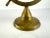 A striking vintage brass ship wheel display stand, artfully crafted and richly patinated, bringing an element of nautical...