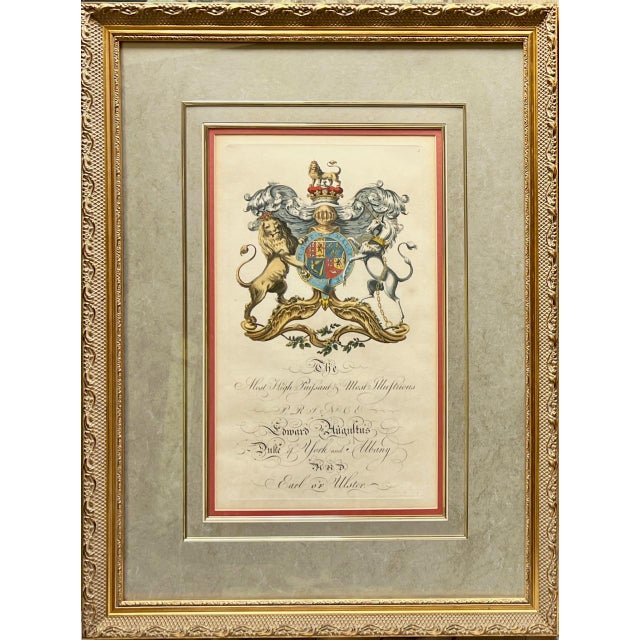 Enhance your collection with this stunning pair of 18th century English, hand colored copper plate engravings of royal...