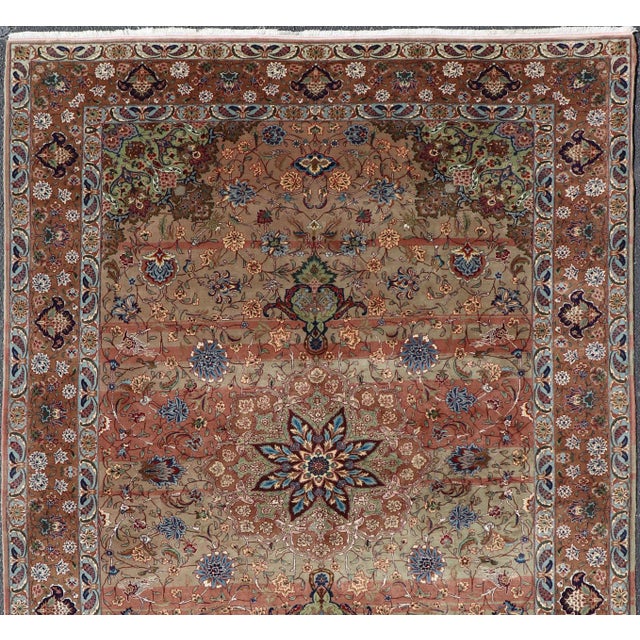 Measures: 6'1 x 9'1 Vintage Persian Tabriz Rug with Silk Accents and Floral Medallion Design. Keivan Woven Arts/...