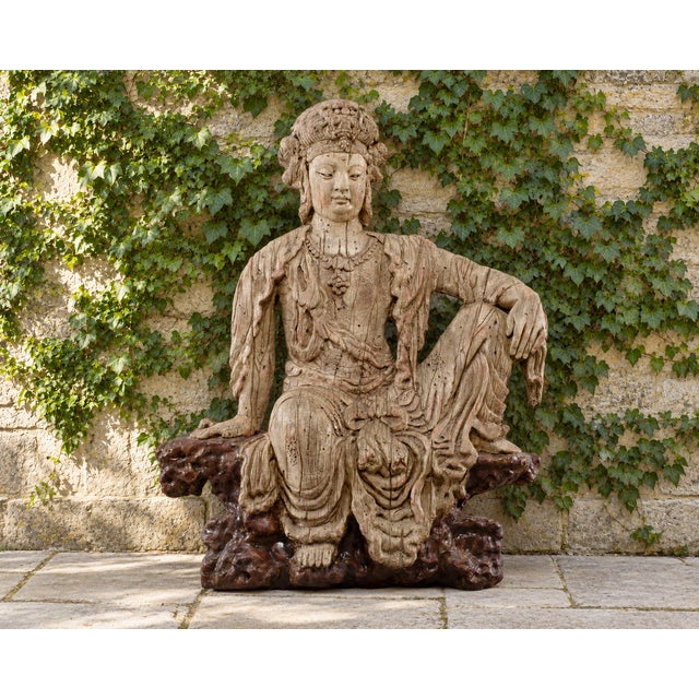 An incredible and large Chinese composite relief figure of a seated Bodhisattva, likely Guanyin, shown in the...