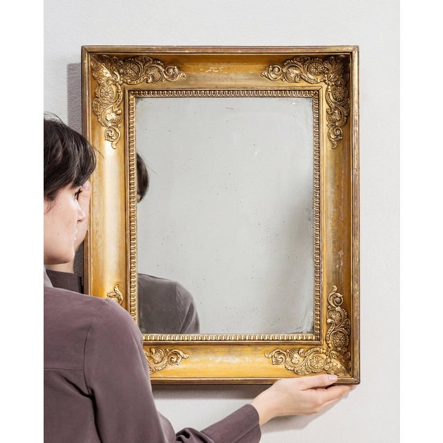 This mirror carries genuine presence, its gold gilt frame, rectangular immediately setting the tone for the piece. The...