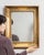 This mirror carries genuine presence, its gold gilt frame, rectangular immediately setting the tone for the piece. The...