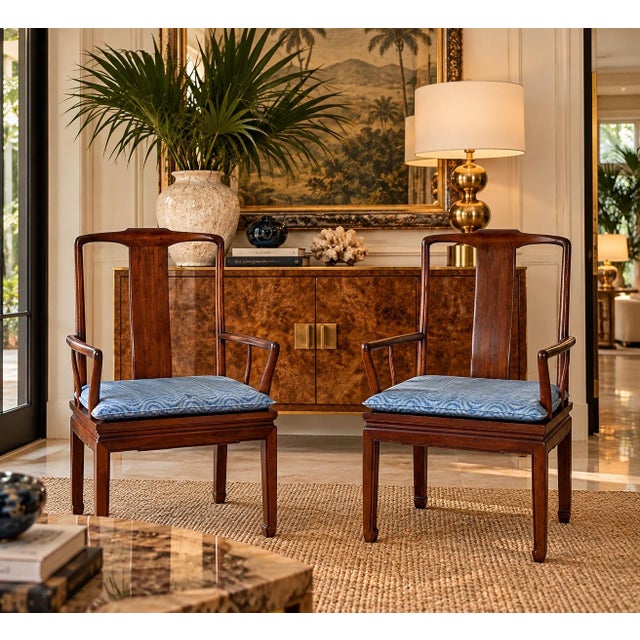 Elegant pair of vintage Henredon Hollywood Regency Chinoiserie dining armchairs, featuring beautifully sculpted mahogany...